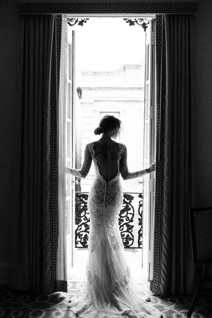 finding ideal client using personal branding techniques connecting with photo business black and white photo of bride at window dress shot